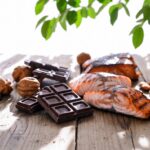 Alimenti per Migliorare l'Umore Pesce Cioccolato Fondente e Frutta Secca